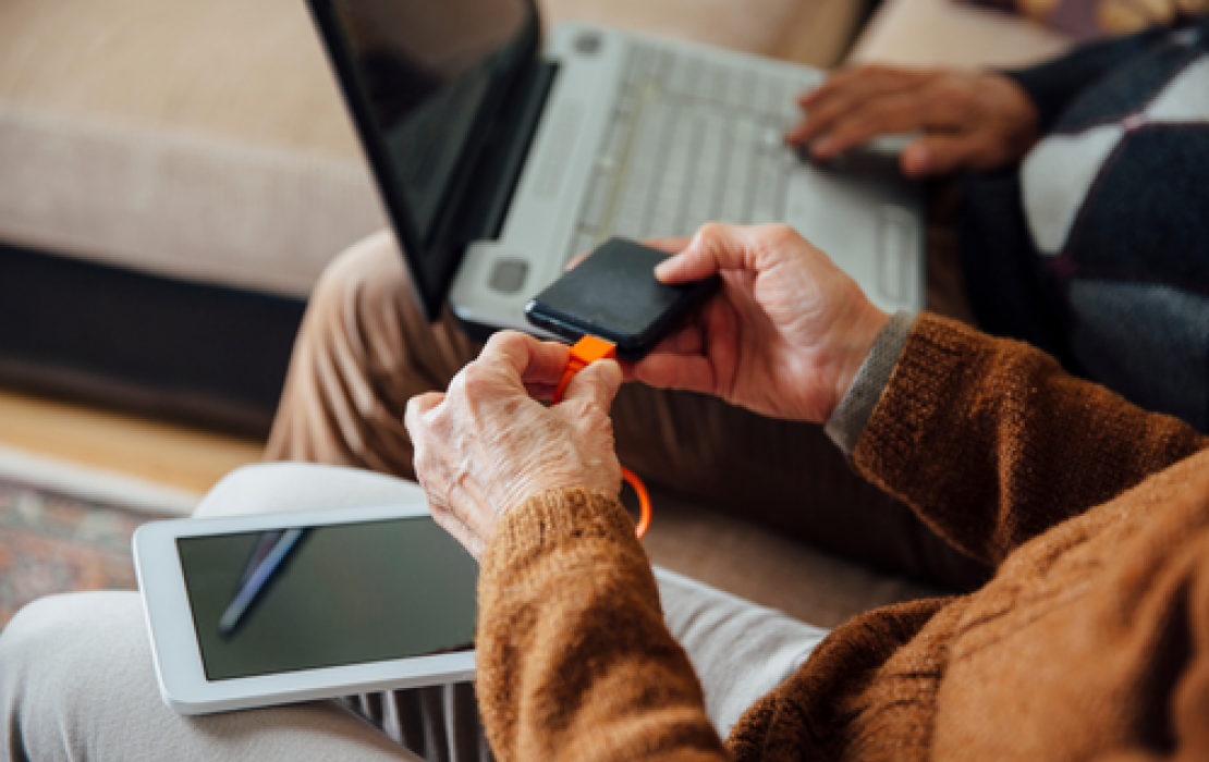Image of a person using their smart phone